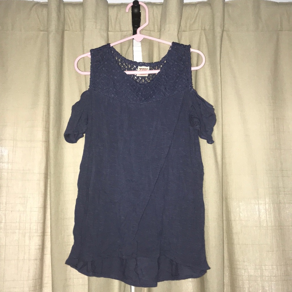 A cold shoulder top with a lace upper back part.
